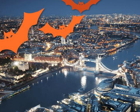 An aerial view of London and Tower Bridge at night