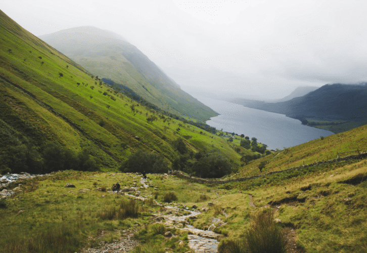 A landscape view of mountains in grey misty weather