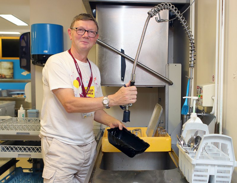 Volunteer Hugh volunteering in our cafe.