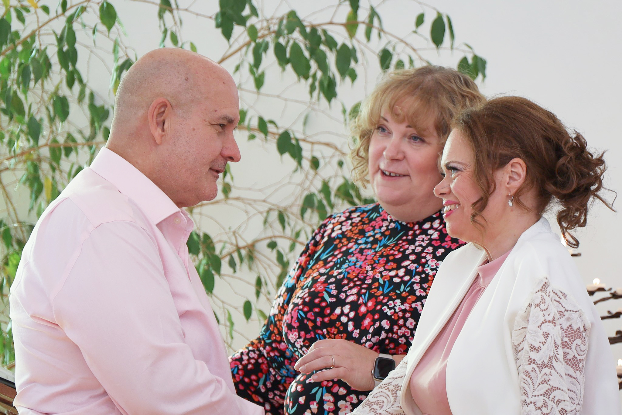 Laura and Terry stand together renewing their vows, with Farleigh Hospice chaplain Susanna beside them.